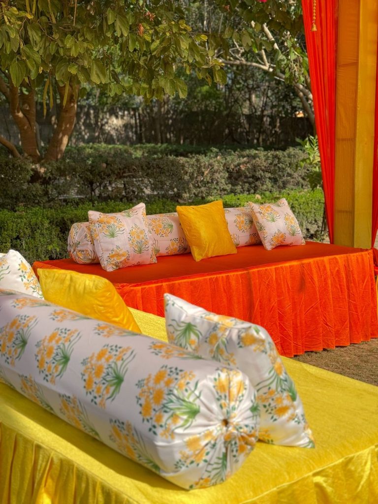 Lounge seating with floral-print cushions.
