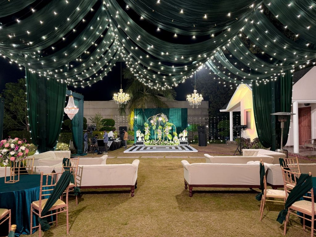 Canopy, string lights and lounges give the stage its wider setting.